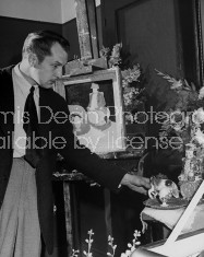 Actor Vincent Price arranging unfinished still life.