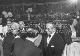 Charles Morrison (white hair) and Comedian George Burns (glasses) during Marion Davies cocktail party.