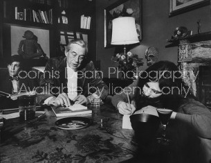 Actor/Director John Huston (C) sitting in the comfortable family room area of his home with his son and daughter.