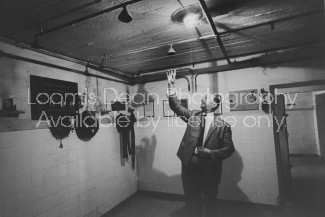 Nazi Pursuer Simon Wiesenthal, inside concentration camp where victims were crowded to take showers, which were not water but lethal gas.