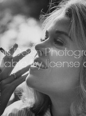 Actress Jane Fonda smoking a cigarette.