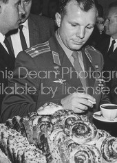 Soviet cosmonaut Yuri Gagarin enjoying pastries during break in International Space Conference.
