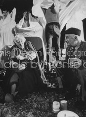 Actress Margaret Rutherford and husband Stringer Davis telling ghost stories to youth around a campfire.
