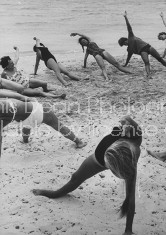 Members of French vacation Club Mediterranee doing exercises on the beach.