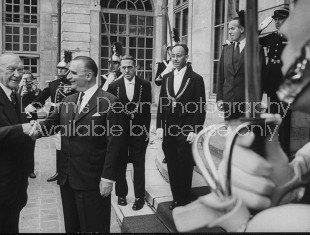 French Premier Georges Pompidou (2L) greeting Konard Adenauer (L) on his visit to France.