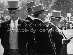 Britain's "Old Etonians" in distinctive top hats, attending the races.
