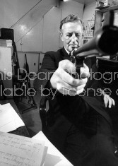 British mystery writer Ian Fleming pointing gun