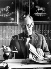 British mystery writer Ian Fleming sitting in his office.