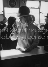 British fashion model Sandra Douglas-Home (C) sipping coffee in airport before New York trip.