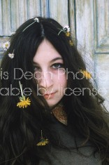 Closeup of actress Angelica Huston w. flowers in her hair.