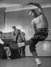 (L-R) Composer/conductor Leonard Bernstein, theater designer Oliver Smith and dancer/choreographer Jerome Robbins in a graceful, balletic pose.