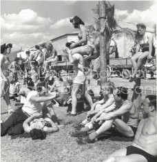 RINGLING CIRCUS PERFORMERS AND STAFF TAKING FIVE ON A HOT DAY 