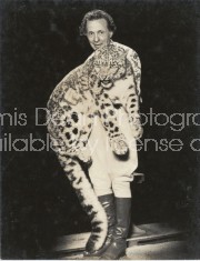 RINGLING CIRCUS TRAINER HOLDING LEOPARD 